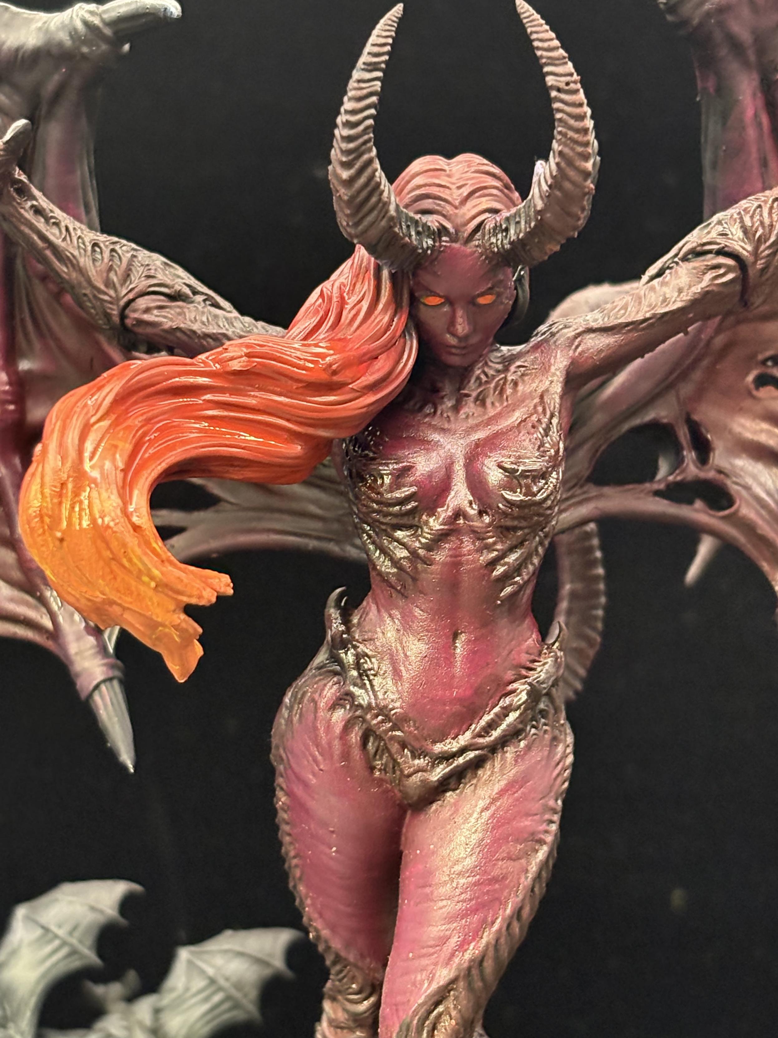 Mid shot of her body and hair. Her hair is a fiery gradient from dark red through orange to yellow highlights